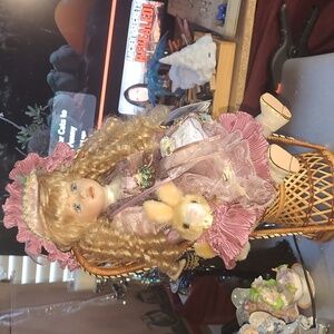 AVAILABLE - VTG porcelain doll 16" Blond curly hair w/ bunny wearing dress